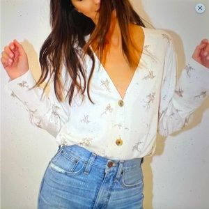 Something navy white and tan v neck button down